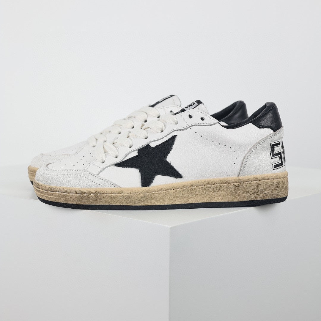 Star patch leather low-top sneakers, black star