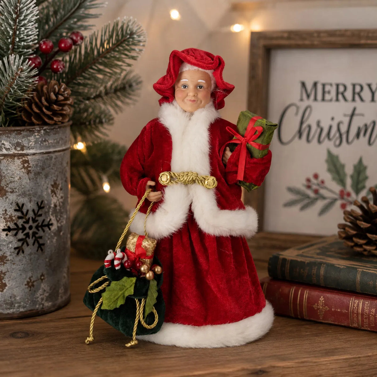 12 inch Mrs. Claus Christmas figure holding a gift and bag