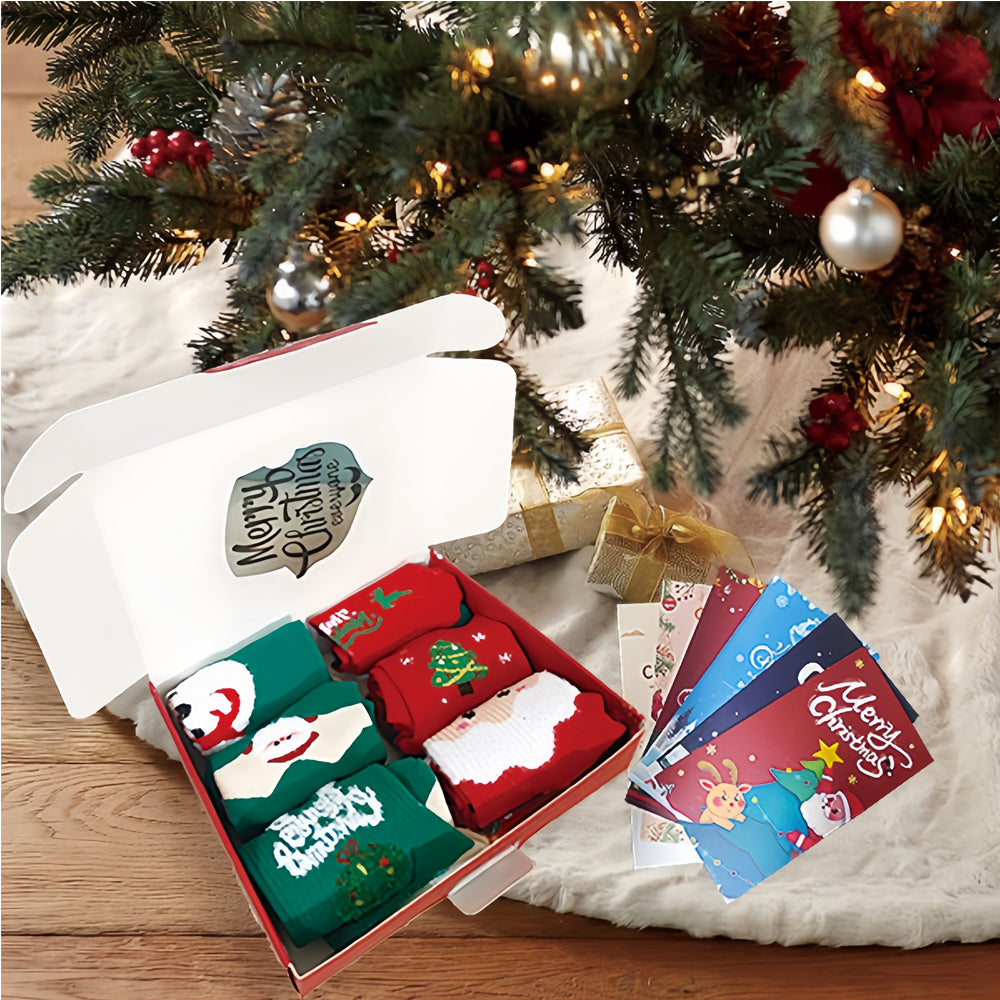 Six pairs of Christmas socks in a gift box with greeting cards