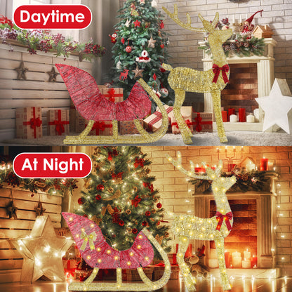 Lighted gold reindeer and red sleigh Christmas decoration