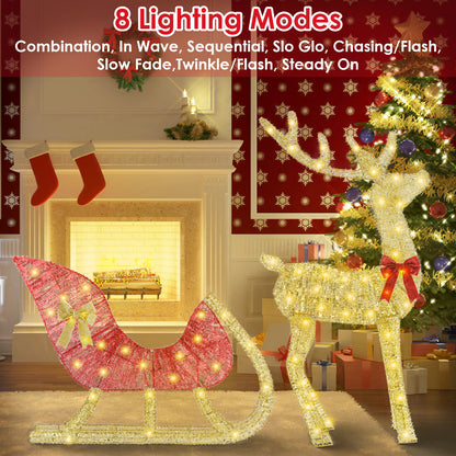 Lighted gold reindeer and red sleigh Christmas decoration