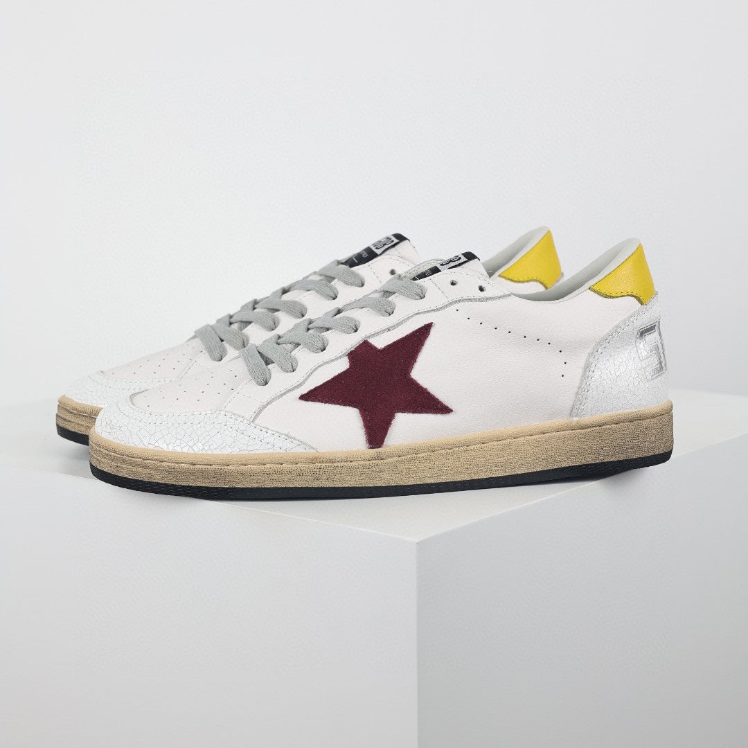 Star patch leather low-top sneakers, burgundy star with yellow heel