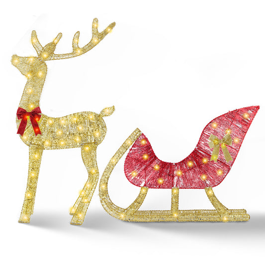Lighted gold reindeer and red sleigh Christmas decoration