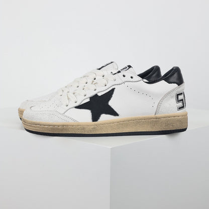 Star patch leather low-top sneakers, black star