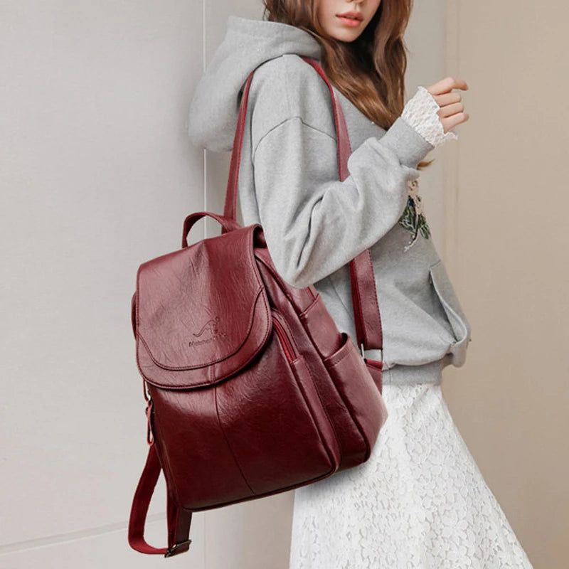 Woman wearing the leather backpack