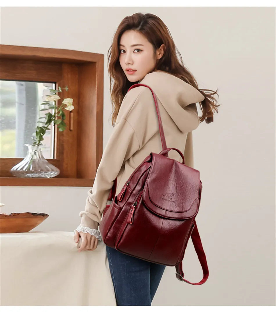 Wine red backpack worn on the shoulder