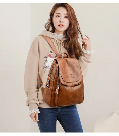 Brown leather backpack worn