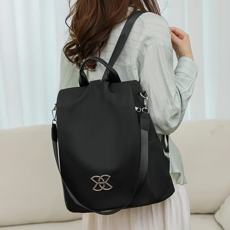 Black anti-theft backpack worn on the shoulder