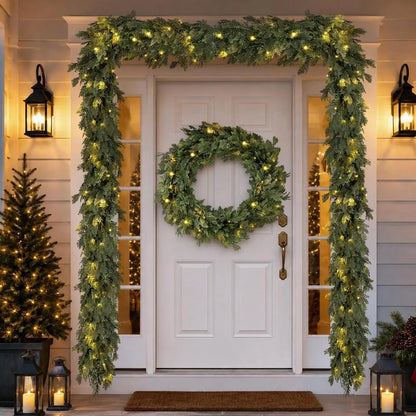Pre-lit cedar garland framing a front door