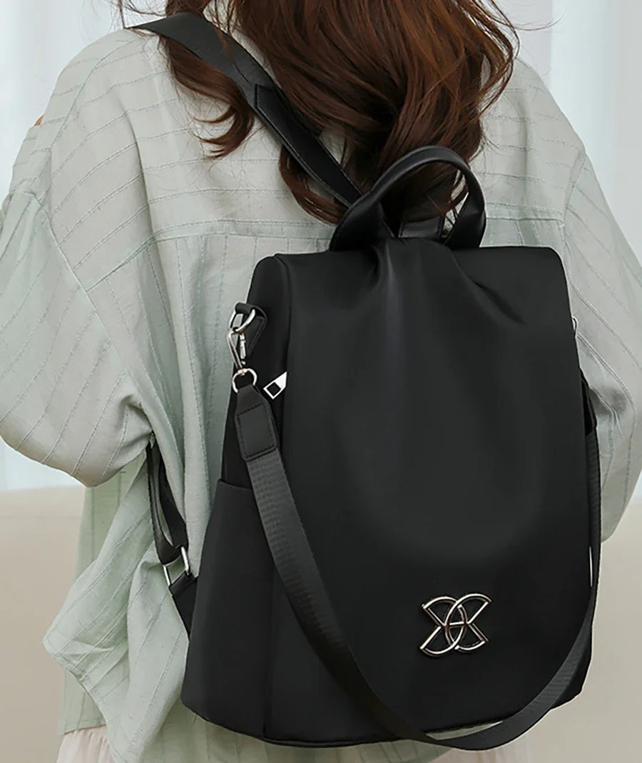Backpack worn showing the hidden back zipper