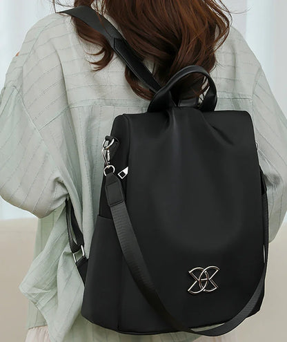 Backpack worn showing the hidden back zipper