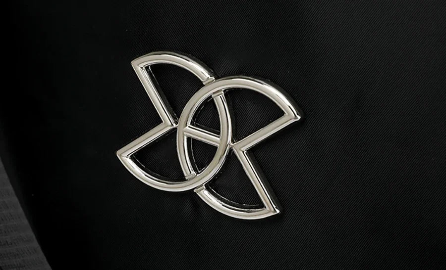 Metal emblem detail on the backpack