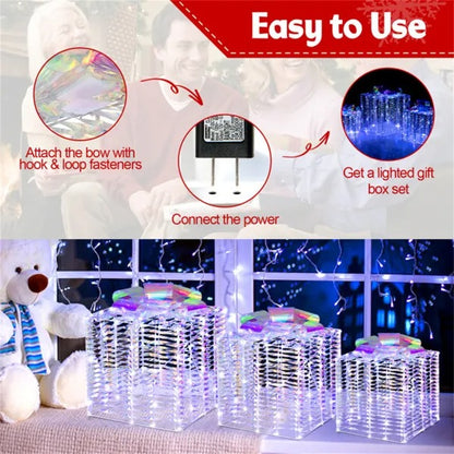 Set of three iridescent lighted Christmas gift box decorations