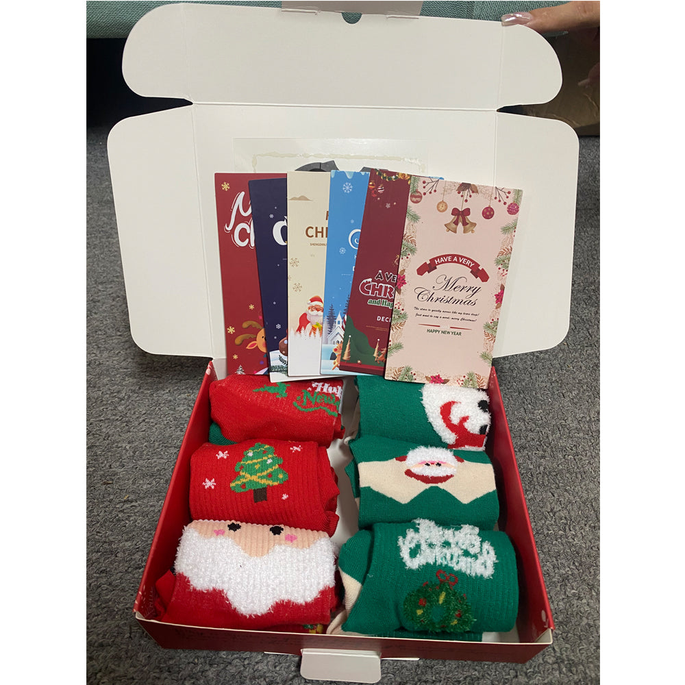 Six pairs of Christmas socks in a gift box with greeting cards