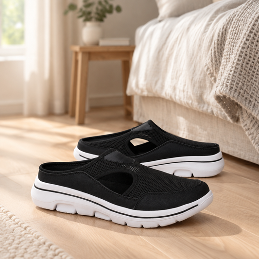 Cushioned slip-on slippers on a pale oak bedroom floor
