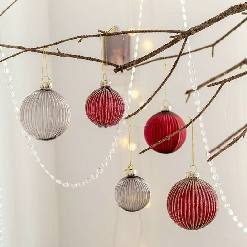 Glass ornaments hanging on branches